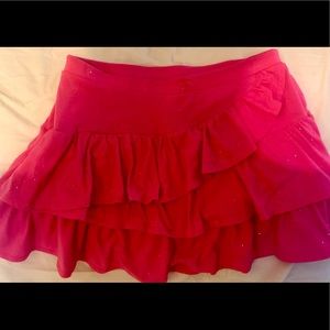 Justice girl’s ruffle skirt w/shorts underneath.